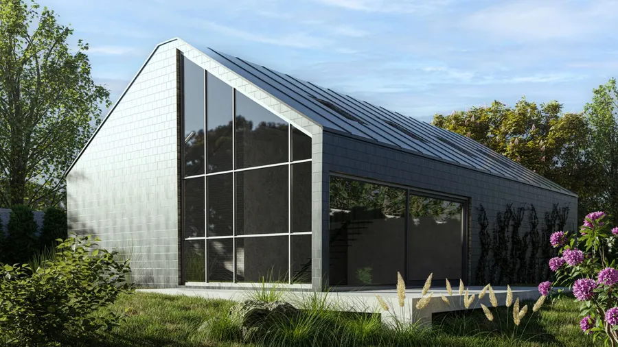 Modern house with large glass windows and sleek design.