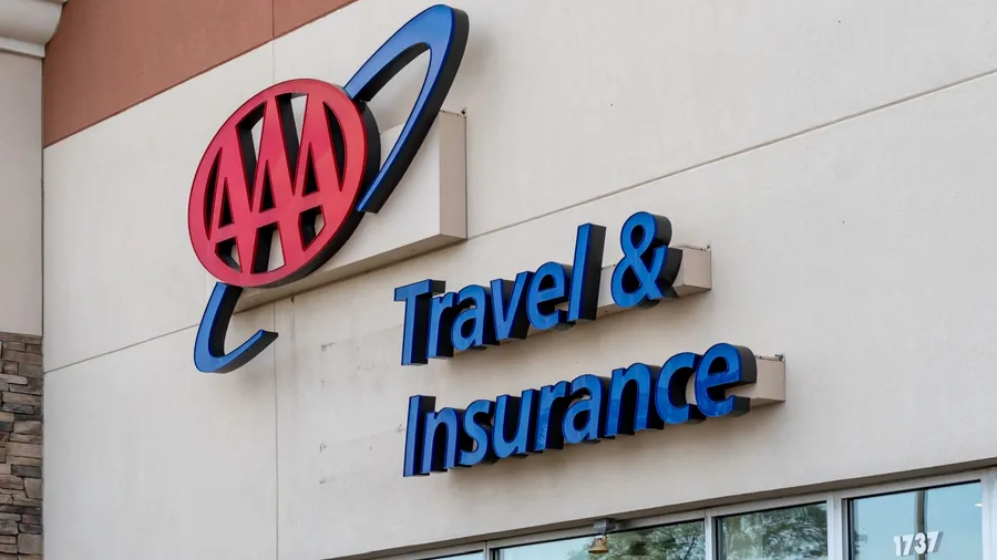 Tonawanda, New York, USA - September 22, 2019: Sign and logo of AAA on the building in Buffalo, New York, USA. The American Automobile Association is a federation of motor clubs