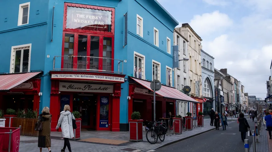 Cork, Ireland, March 29 2023: St princess shopping street with retail and department stores on a cloudy day. Cork Ireland Europe