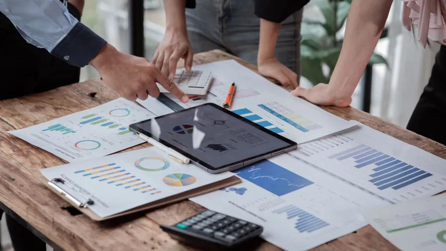 Accounting company provide finance and taxation planning for profitable cash flow, Auditor and accountant team working in office, analyze financial data and accounting record with calculator.Insight