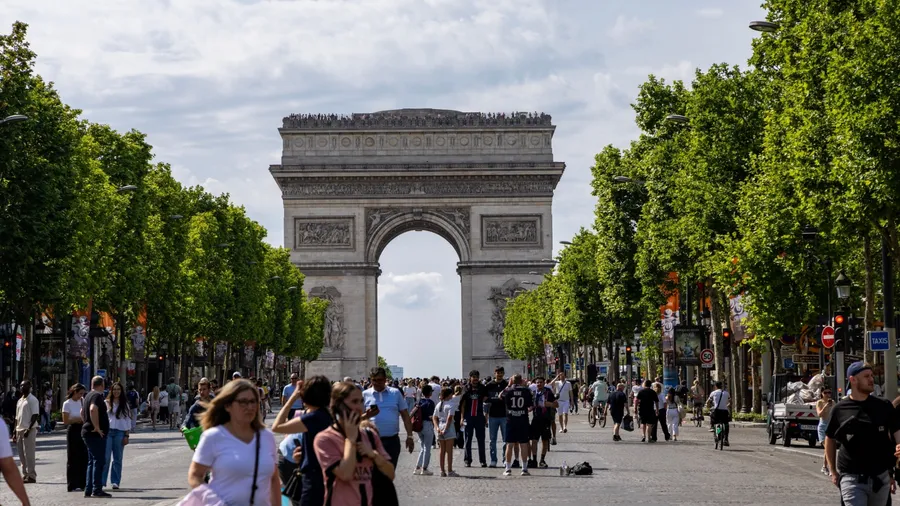 Paris, Tourists Arc de Triomphe on Charles de Gaulle Square. City life. Lifestyle.