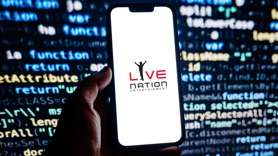 Stuttgart, Germany - 07-24-2023: Person holding cellphnoe with webpage of US company Live Nation Entertainment Inc. on screen in front of logo. Focus on center of phone display. Unmodified photo.