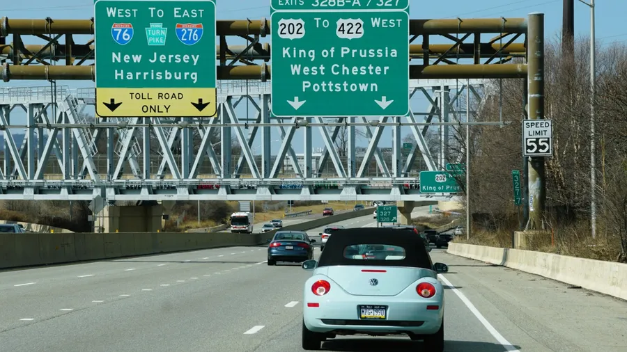 Pennsylvania, U.S.A - April 7, 2025 - Traffic on the highway with exits to King of Prussia, West Chester, Pottstown and PA Turnpike into New Jersey and Harrisburg