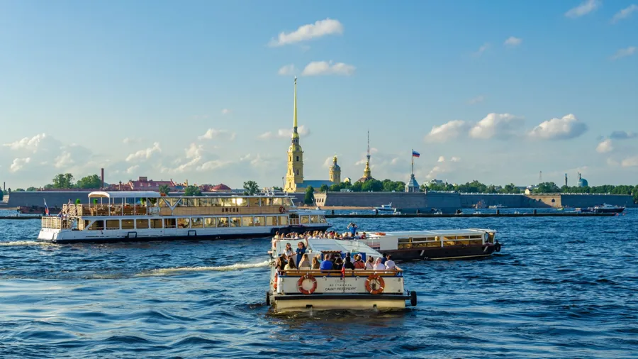 Saint Petersburg.Russia.June 25, 2021. Pleasure boats and motor ships on the Neva River in summer.