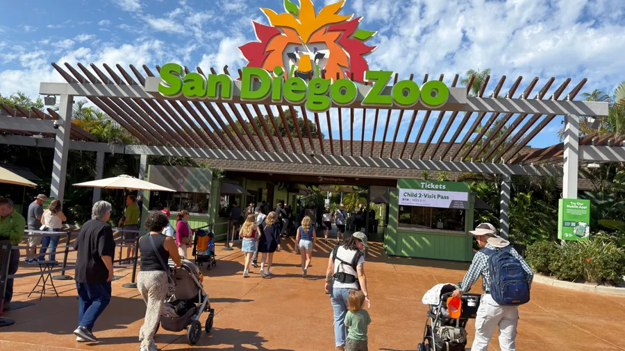 San Diego, CA, USA - October 9, 2025: Visitors heading through the entrance of the San Diego Zoo in California, a world-famous destination for wildlife and conservation.