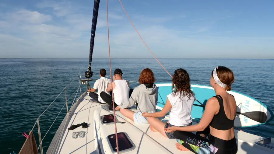 REPUBLIC OF CRIMEA - SEPTEMBER 10, 2021:Morning meditation on a yacht in the Black Sea