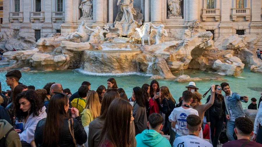 Rome, Italy, April. 2023 One of the absolute tourist hotspots in Rome is the Trevi Fountain that draws the crowds