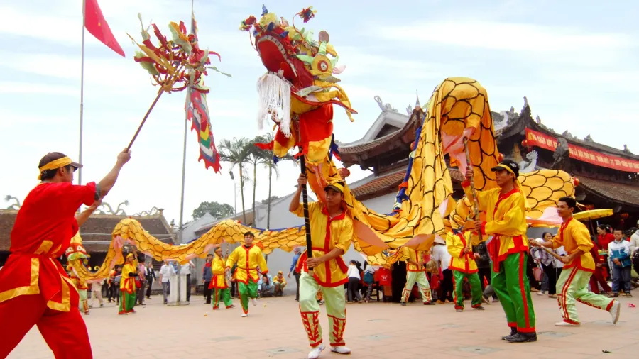 a group of unidentified dancer with their colorful dragon on