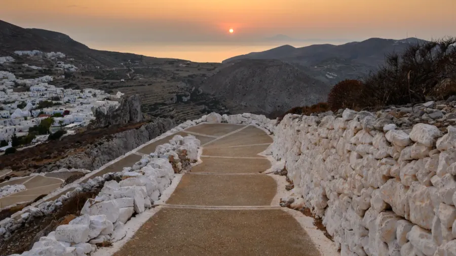 a path on a hill overlooking the cliffs and the