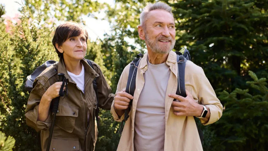 a senior couple explores the great outdoors sharing smiles and
