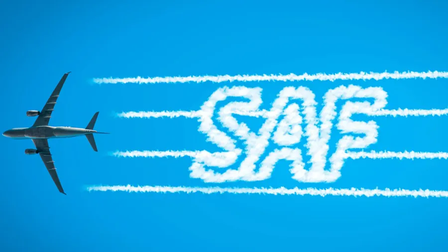 airplane leaving jet contrails with saf word inside concept of