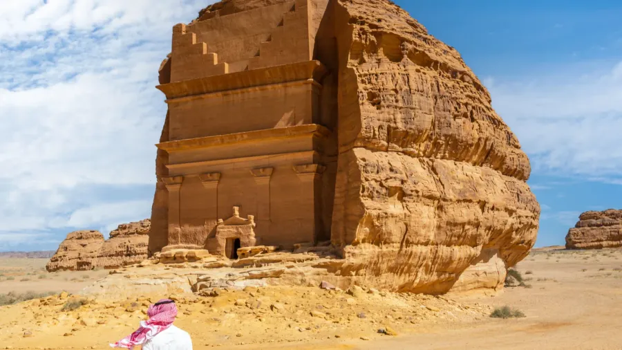 arab man in front of tomb of lihyan son of