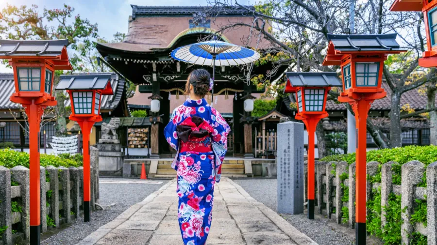 asian woman wearing japanese traditional kimono at kyoto temple in