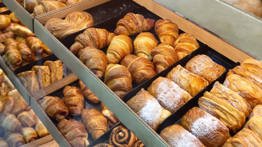 assortments of different bakery products on the bakery showcase food