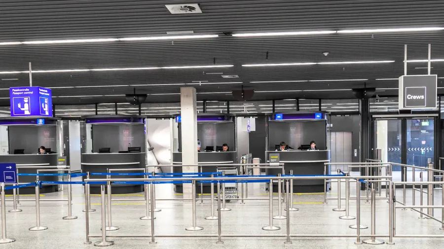 border control police waits for incoming passenger