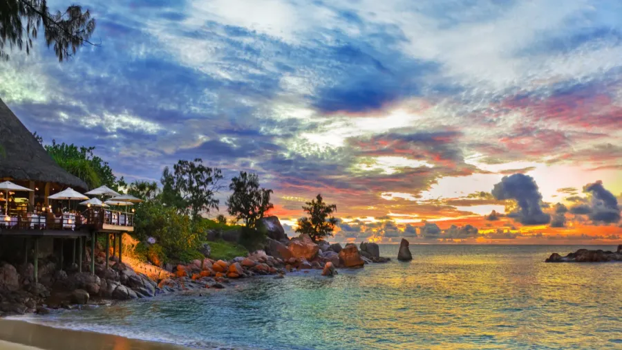 cafe on tropical beach at sunset