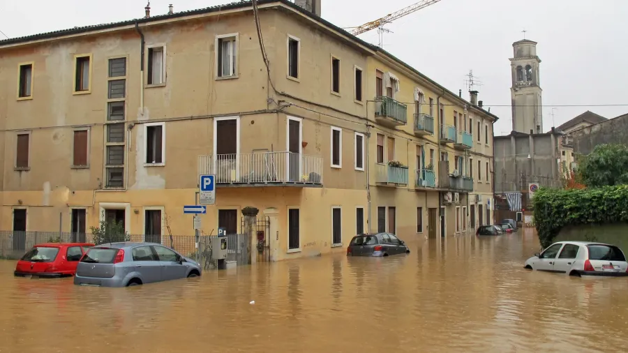 cars in the streets and roads submerged by the mud