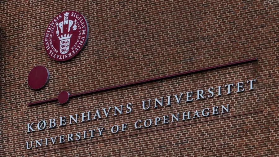 copenhagen denmark a sign on a brick building for the