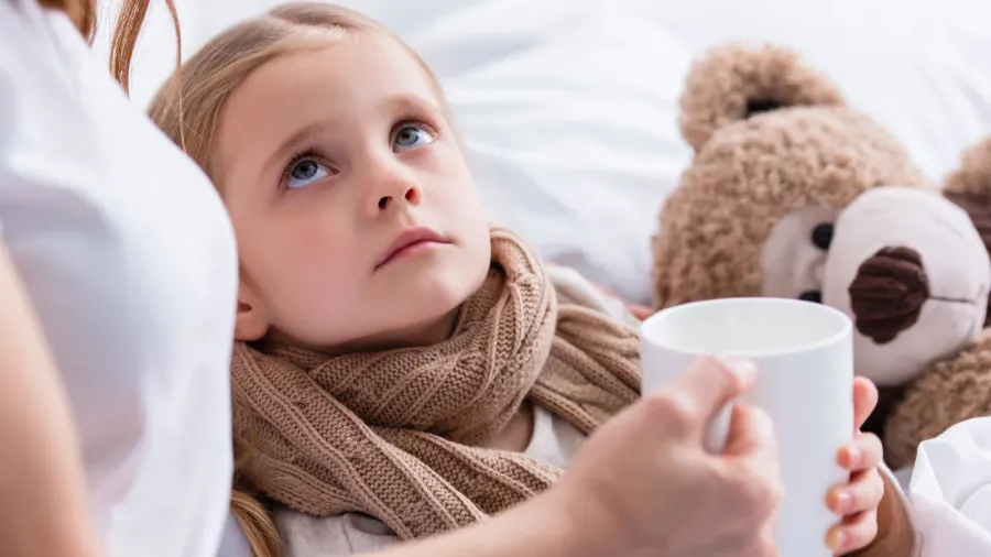cropped image of mother taking care of sick daughter in