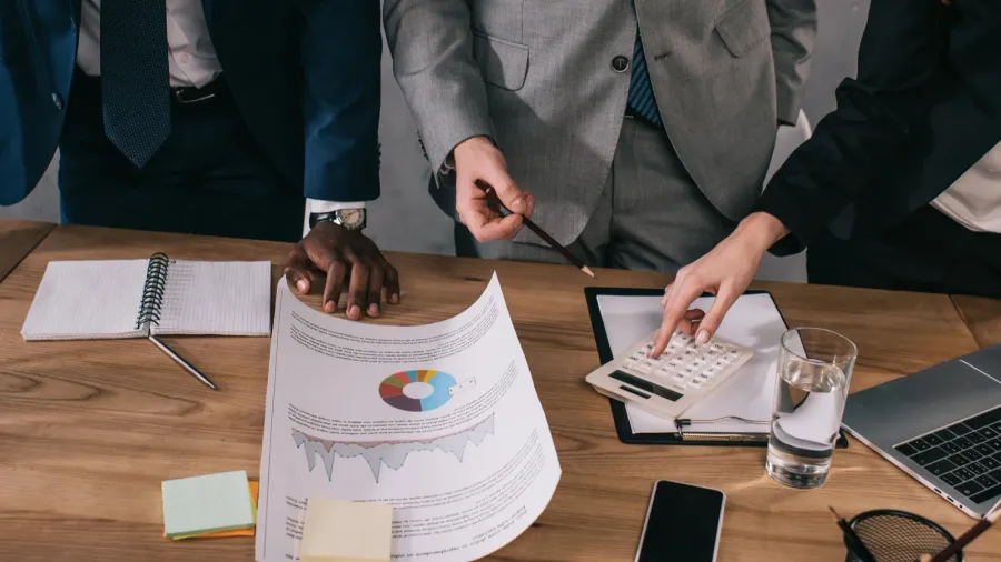 cropped view of business colleagues doing paperwork