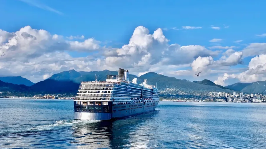cruise ship taking off from port of vancouver and sailing