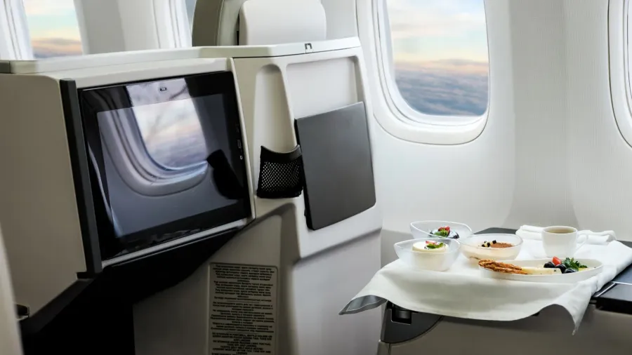dessert and coffee on a commercial plane