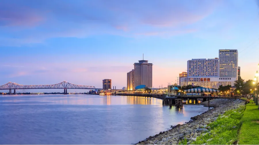 Downtown New Orleans, Louisiana and the Missisippi River at twilight.
