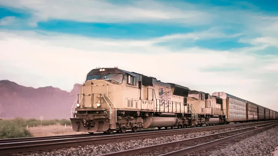 freight train traveling through desert