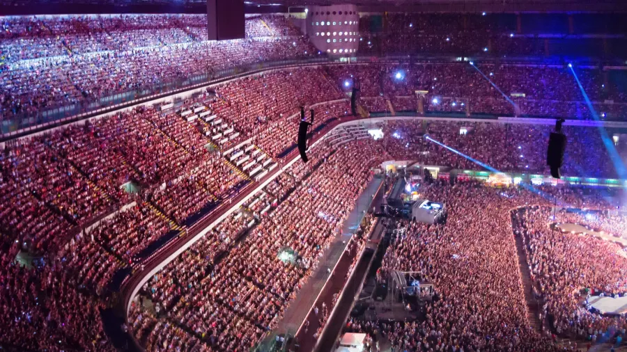 large crowd of people watching concert