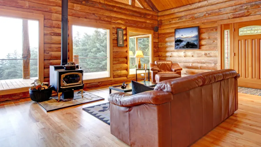 luxury log cabin living room with leather sofa