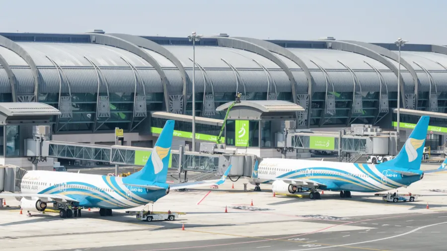 oman air aircraft parked at muscat international airport