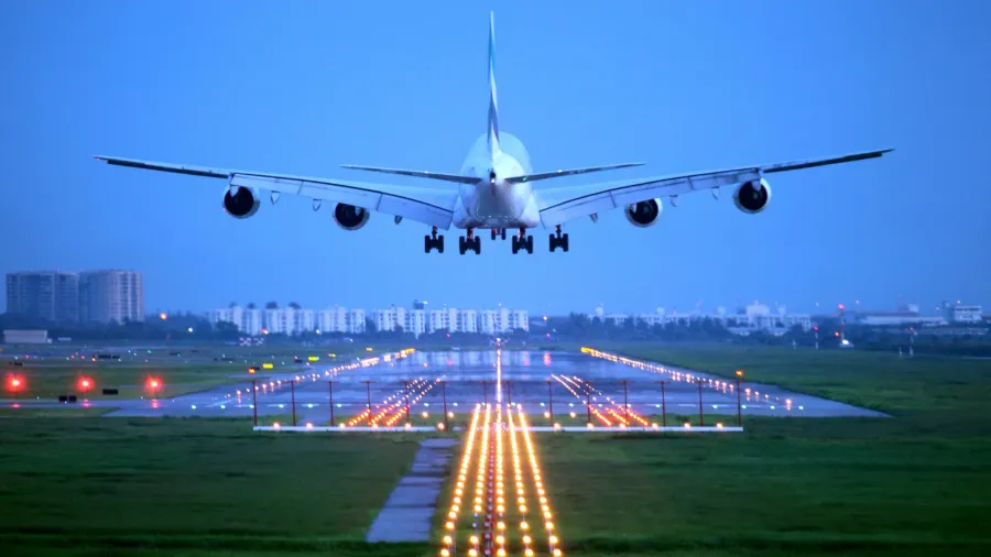 passenger plane fly up over takeoff runway from airport