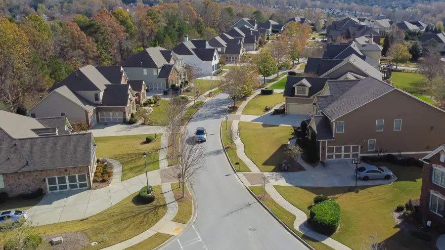 residential street in new development neighborhood subdivision with row of