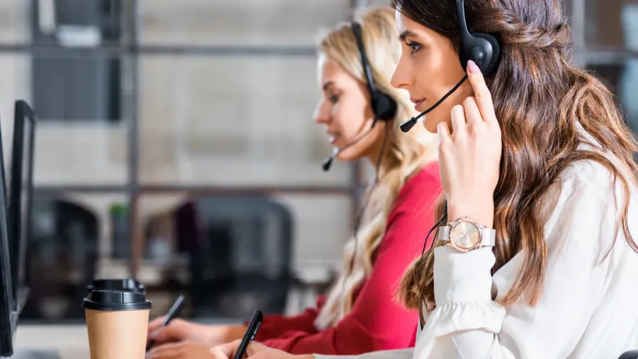 side view of female call center operators working at workplace