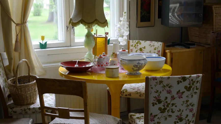 small cozy room filled with furniture and utensils