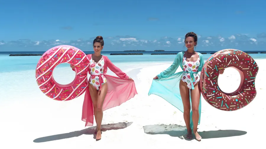 summer vacation happy free two women with inflatable donut floa