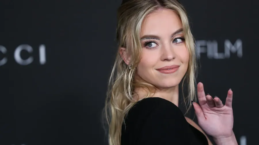 sydney sweeney wearing a saint laurent dress arrives at the