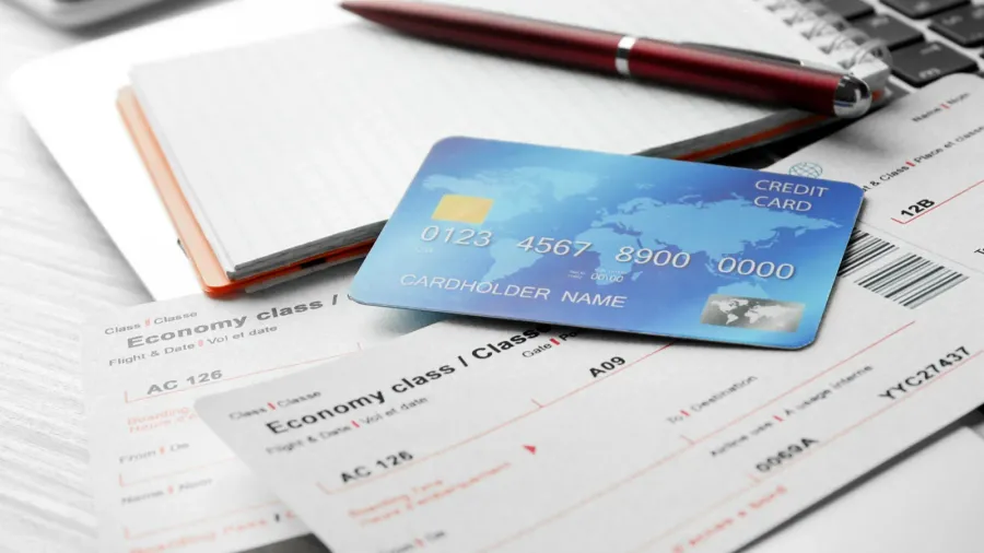 tablet with credit cards and tickets
