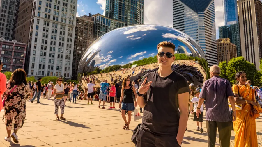 tourists in the millennium park around the cloud gate in
