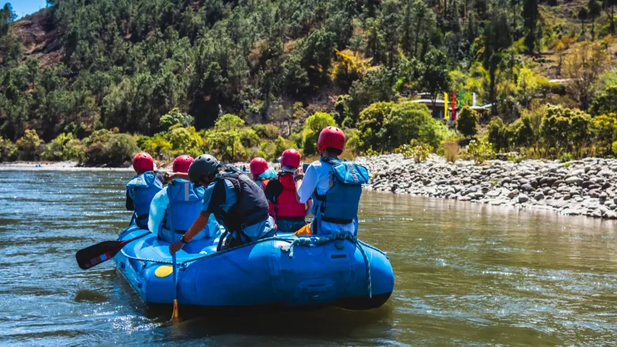 tourists ride on the rafting facility providing an interesting experience