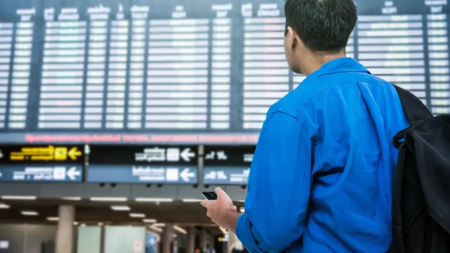 traveler using smartphone for checkin