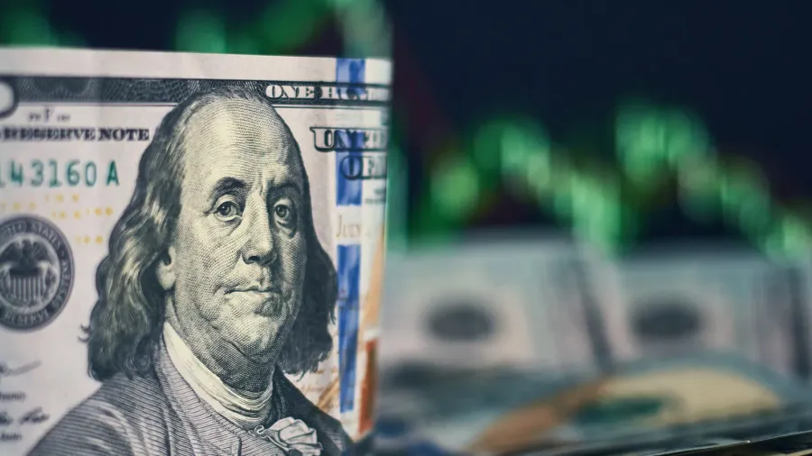 us dollar bills on a background with dynamics of exchange