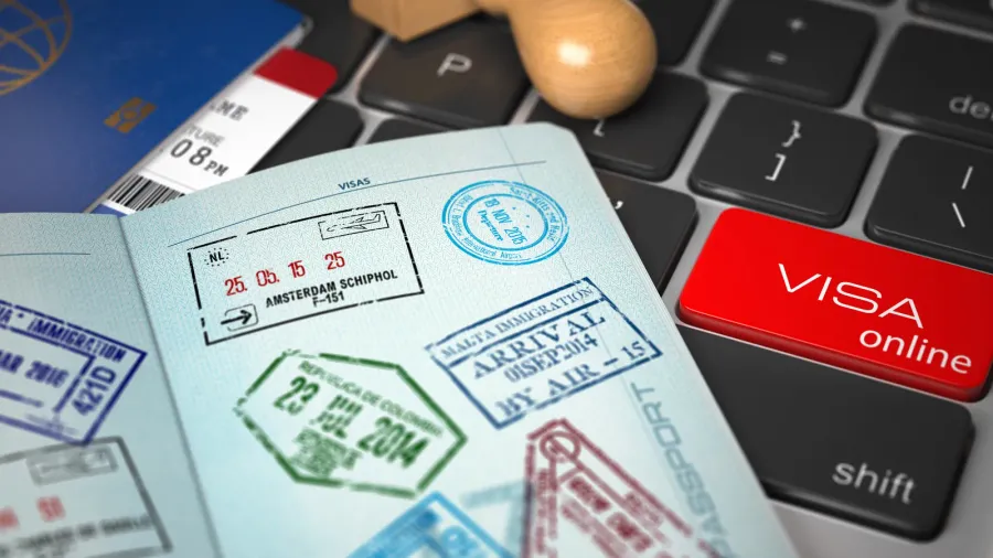 visa online application concept opened passport with visa stamp