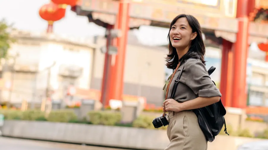 A tourist happily exploring China.